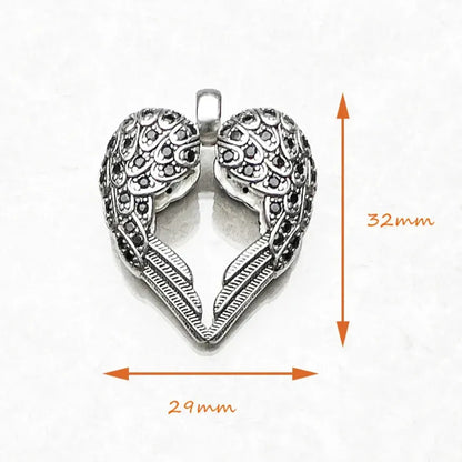 delicate silver winged heart jewellery size