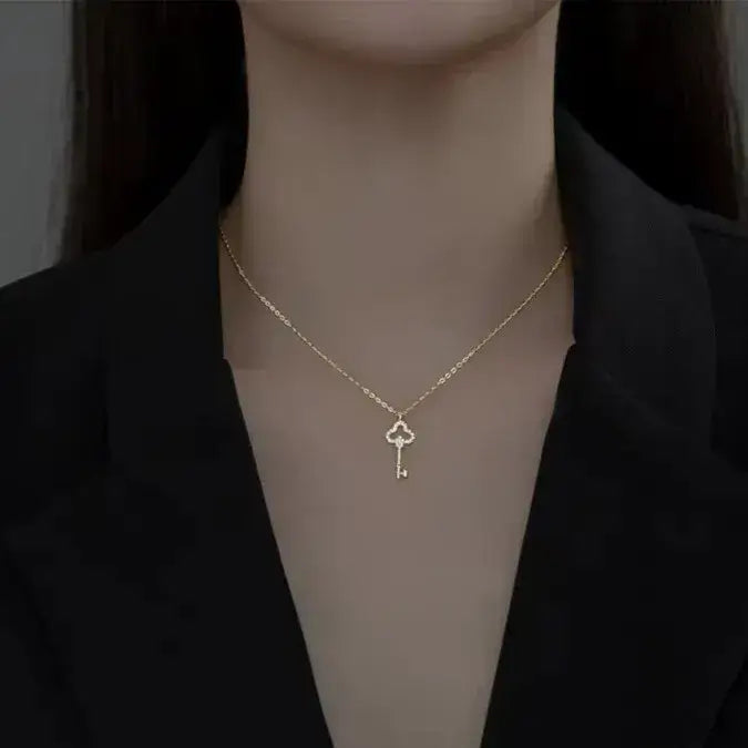 gold clover key necklace close-up