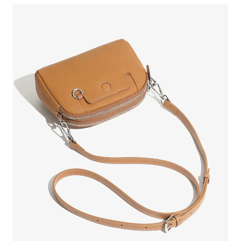 Side profile — slim, structured vintage leather handbag