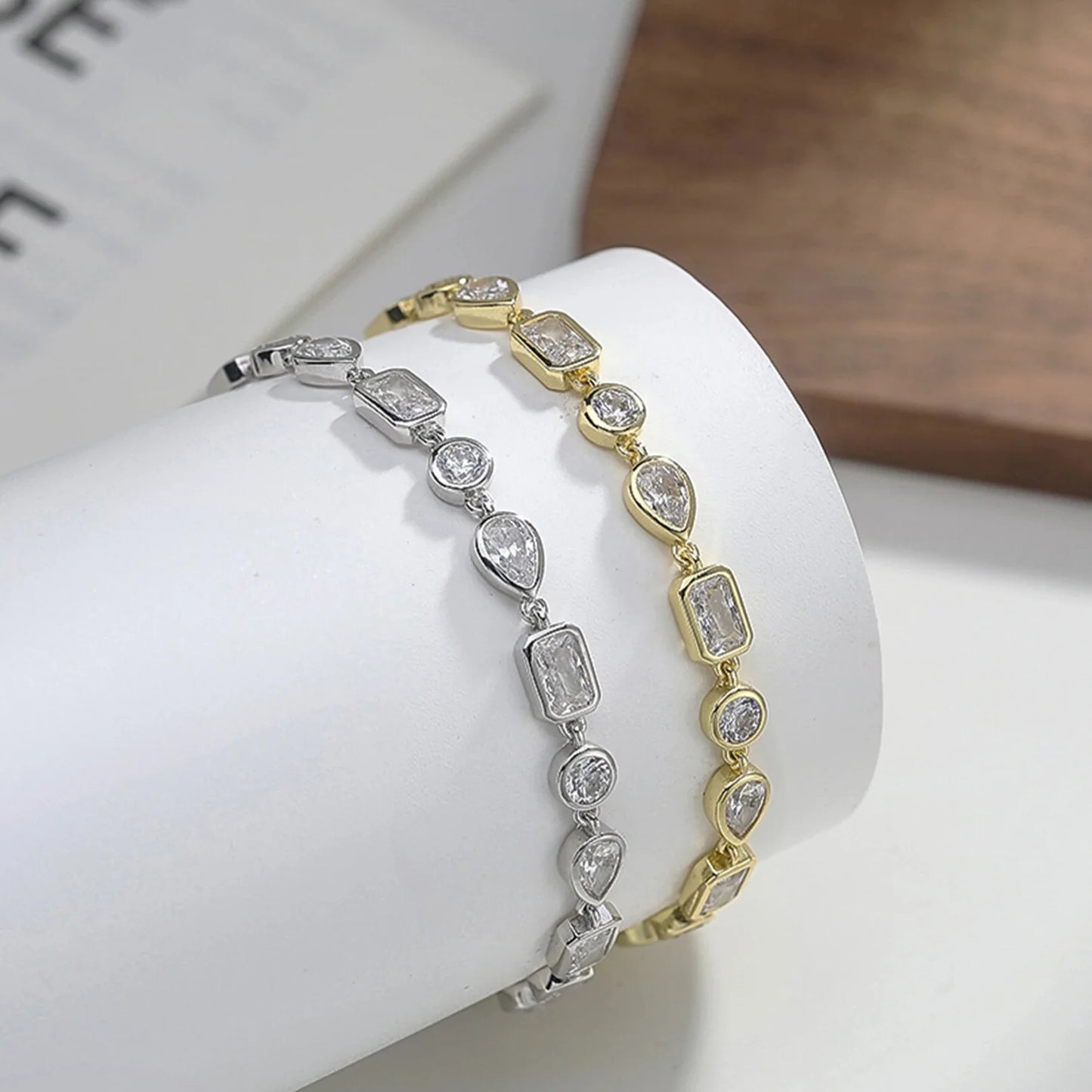 Close-up of square, oval and teardrop zircon tennis bracelet