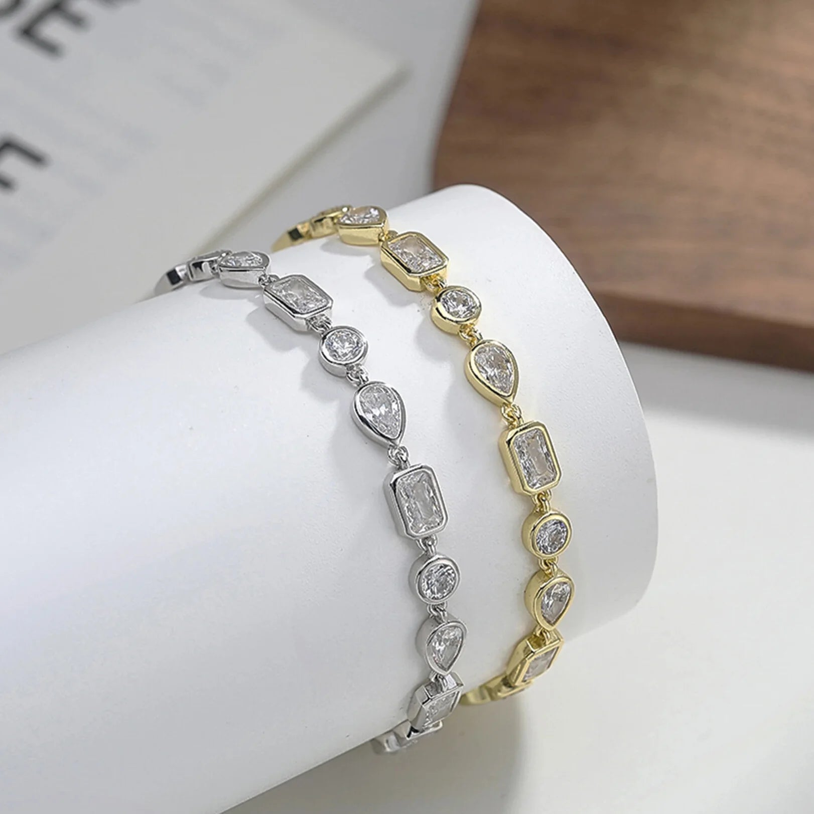 Close-up of square, oval and teardrop zircon tennis bracelet